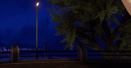 a cartoon rabbit is standing in front of a bridge with a street light in the background