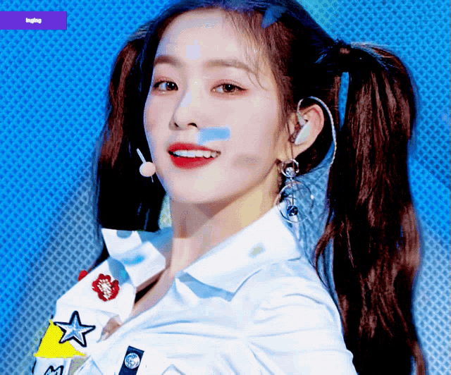 a close up of a woman 's face with ponytails and a purple background that says ' i love you '
