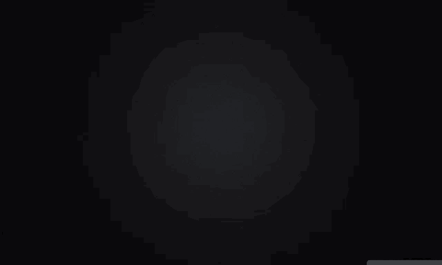a black background with a gray gradient in the middle .