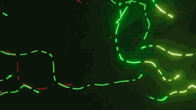 a bunch of green and red lines on a dark background