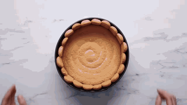 a pie with a swirl of cookies on top of it