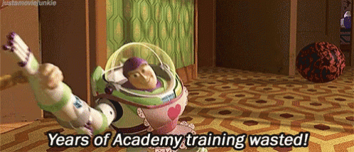 buzz lightyear from toy story is holding a gun and saying years of academy training wasted !