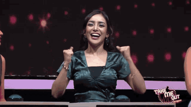 a woman sitting at a table with the words take me out on the bottom
