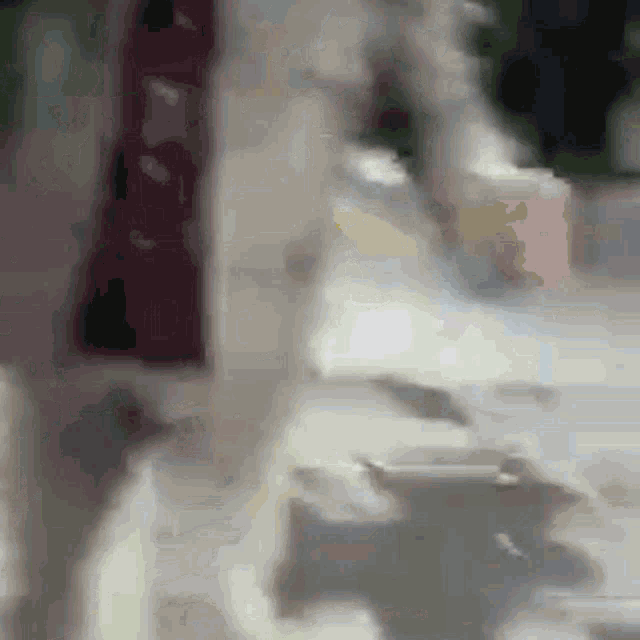 a blurred image of a person walking down a street