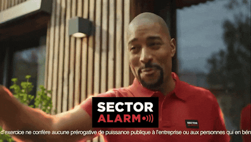 a man in a red shirt with the word sector alarm on it