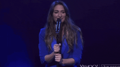 a woman singing into a microphone with the words because i 'm a narcissist