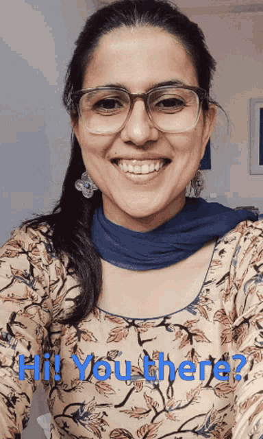 a woman wearing glasses and a blue scarf smiles with the words " hi you there " written below her