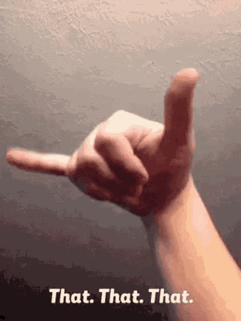 a person 's hand is making a sign that says " that that that "