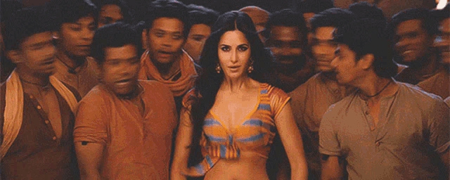 a woman in a striped top is surrounded by men