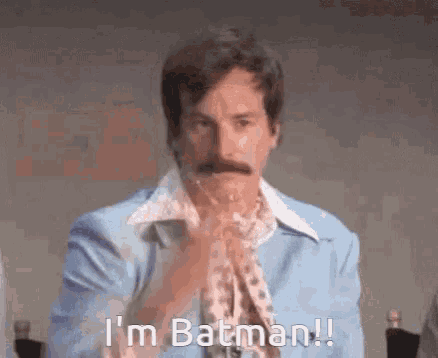 a man with a mustache is saying i 'm batman ..