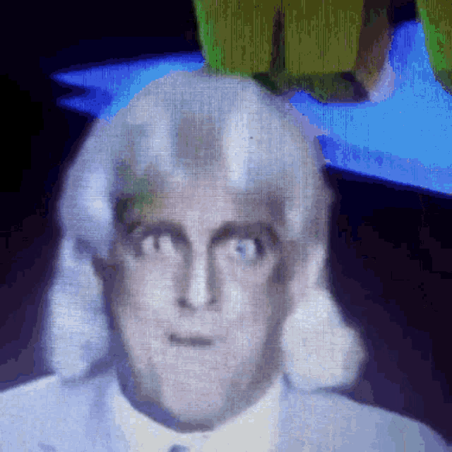 a close up of a man 's face on a screen