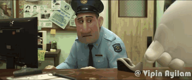 a cartoon police officer is sitting at a desk in front of a computer monitor