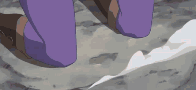 a person in purple pants is walking on a rocky ground