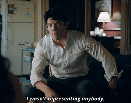 a man in a white shirt is sitting on a couch and saying i wasn 't representing anybody