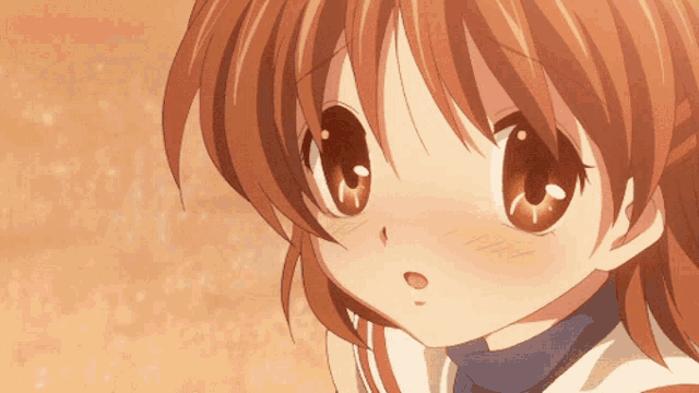 a close up of a girl 's face with a surprised expression