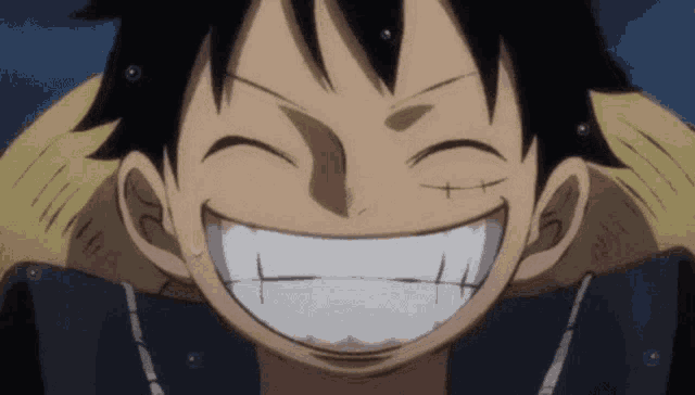 a close up of a person 's face with a big smile on their face .