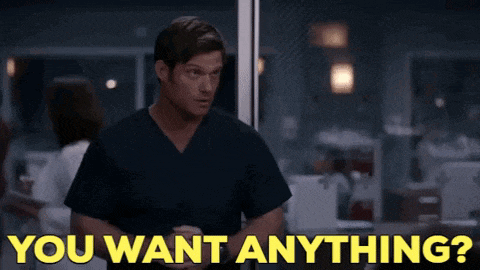 a man in scrubs says " you want anything " in a hospital