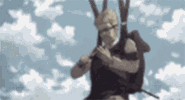 a blurry picture of a man holding a gun in the sky