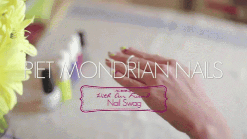 a close up of a woman 's hand with the words " piet mondrian nails " written above it