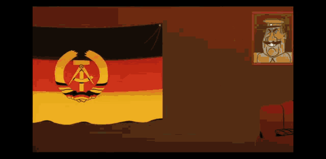 a picture of a man with a mustache hangs next to a flag with the letter k on it