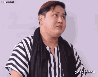 a woman wearing a black and white striped shirt has the name jei-jeisan on her shirt