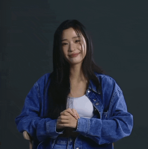 a woman wearing a calvin klein shirt and bra