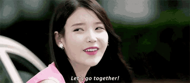 a close up of a woman 's face with the words `` let 's go together '' written on it .