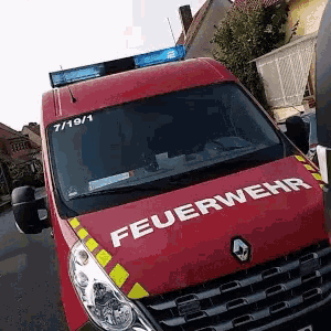 a red van with the word feuerwehr written on the front