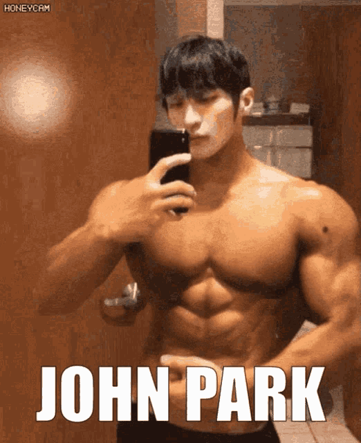 a man taking a picture of himself with the name john park written on the bottom