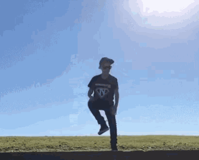 a man wearing a black shirt that says n on it