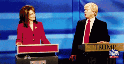 a man and a woman are standing at a podium that says trump