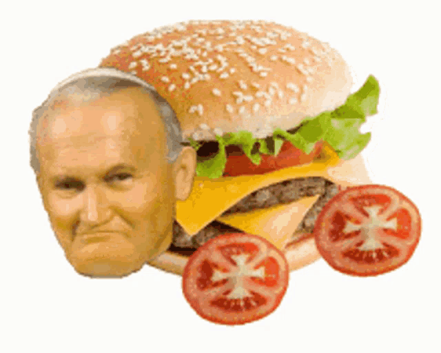 a hamburger with a man 's face on it and tomatoes