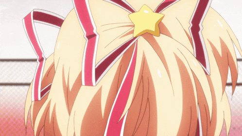 a close up of a girl 's hair with a yellow star in it