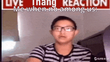 a young boy wearing glasses is sitting in front of a sign that says live thang reaction me when no among us .