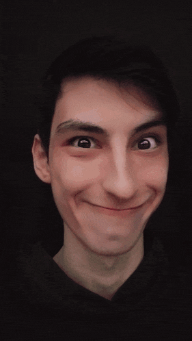 a close up of a man making a funny face with his eyes crossed