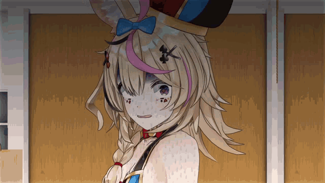 a girl in a bunny costume is standing in front of a wall