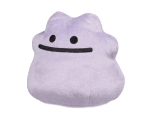 a purple pillow that looks like a monster with circles on it