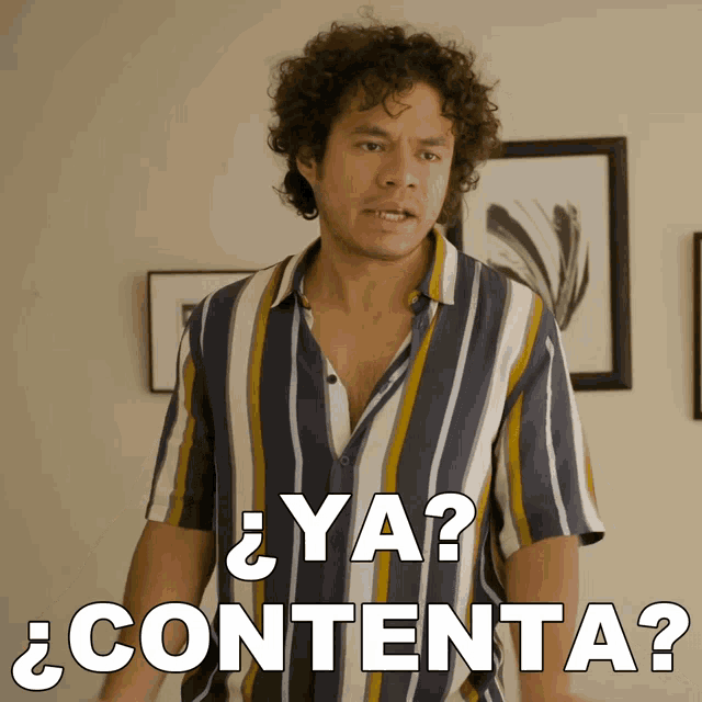 a man in a striped shirt says ya contenta in white letters