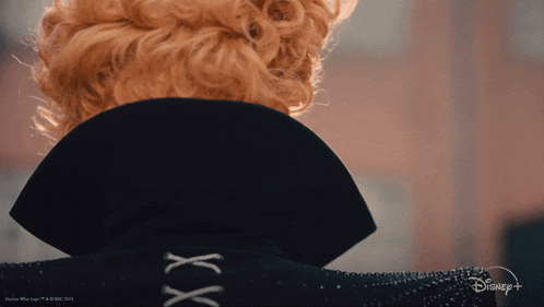 a close up of a person 's back with a disney logo
