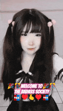 a girl with pigtails and a welcome to the badass society sign