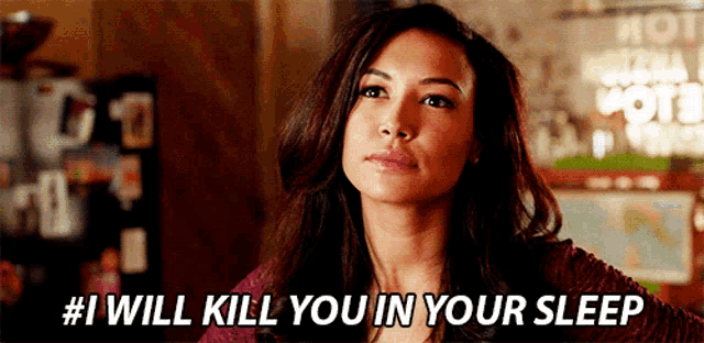 a woman says # i will kill you in your sleep in front of a map