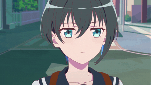 a girl with short black hair has blue eyes