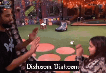 a man and a girl are giving each other high fives and the words dishoom dishoom are on the bottom of the image