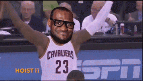 a man wearing glasses and a cavaliers jersey