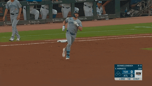 a baseball game is being played between the tor and atl teams
