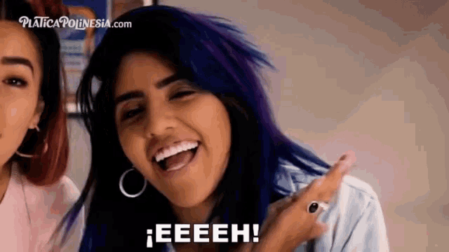 a woman with purple hair says eeeeh in front of two other women