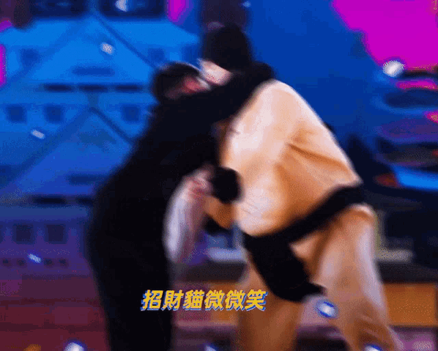 a blurry picture of two people with chinese characters on the bottom