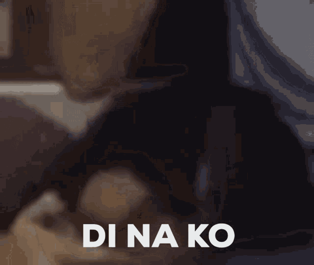 a blurred image of a person laying on a bed with the words di na ko above them
