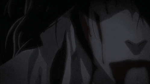 a close up of a person 's face with blood coming out of it 's mouth