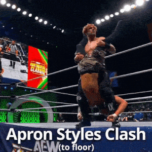 an apron styles clash is being performed in a ring
